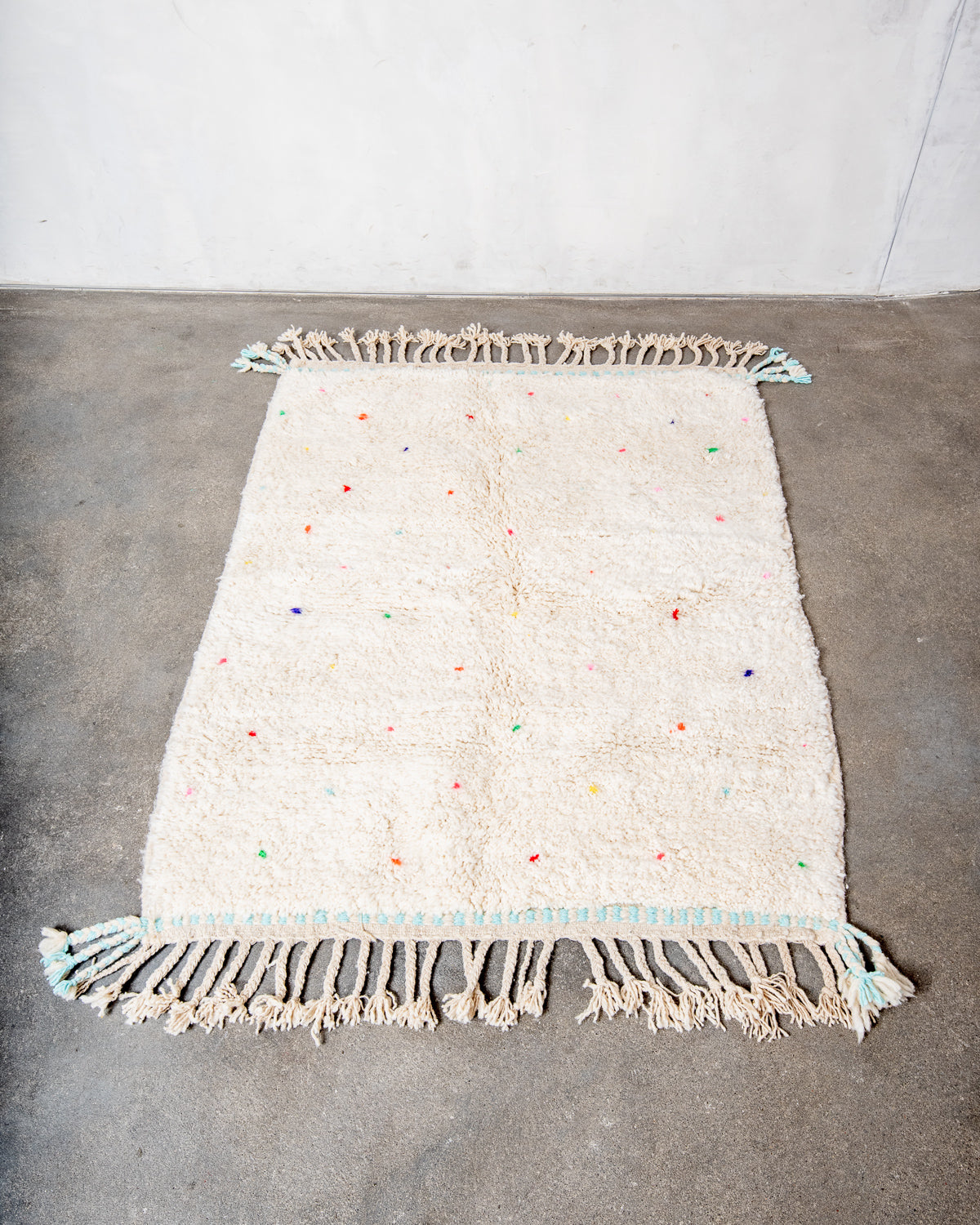 Modern, designer, handcrafted Berber rug from Morocco. Beniourain carpet with beautiful colours and patterns and fluffy wool texture.